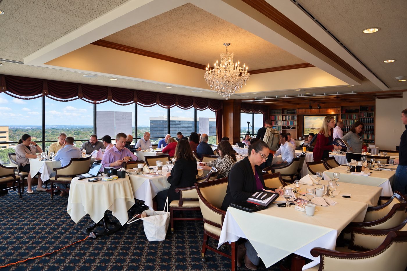 A room of San Antonio business owners working at tables